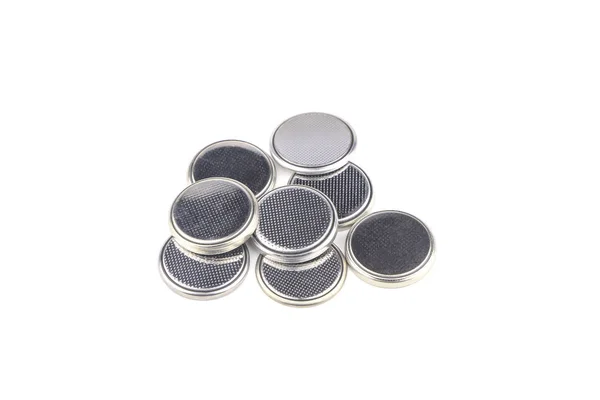 Heap of lithium button cell batteries. Closeup. Isolated on whit — Stock Photo, Image