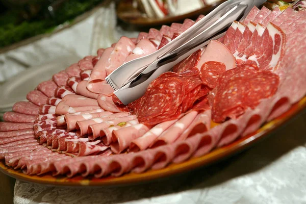 Antipasto plate at a party or event with mortadella, salami, pep Stock Photo