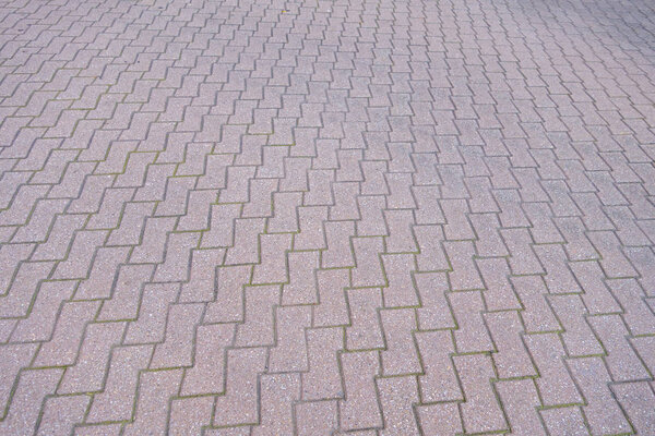 Interlocking outdoor brink stone paving street driveway. walkway in an angle perspective
