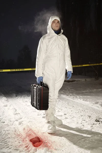 Technician leaving location after praparing shoe print for casting — Stock Photo, Image