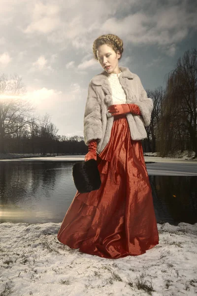 Woman in red apparel and fur coat — Stock Photo, Image