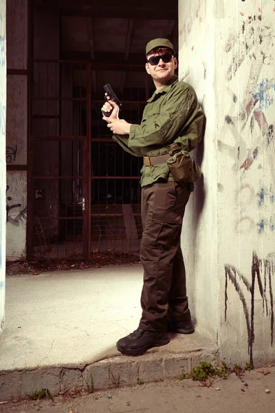 Soldier on sentry duty with loaded pistol — Stock Photo, Image