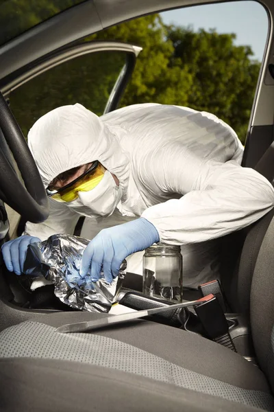 Collecting of odor traces by criminologist technician from gear shift — Stock Photo, Image