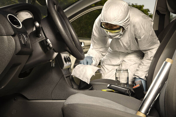 Collecting of odor traces by criminologist technician from gear shift