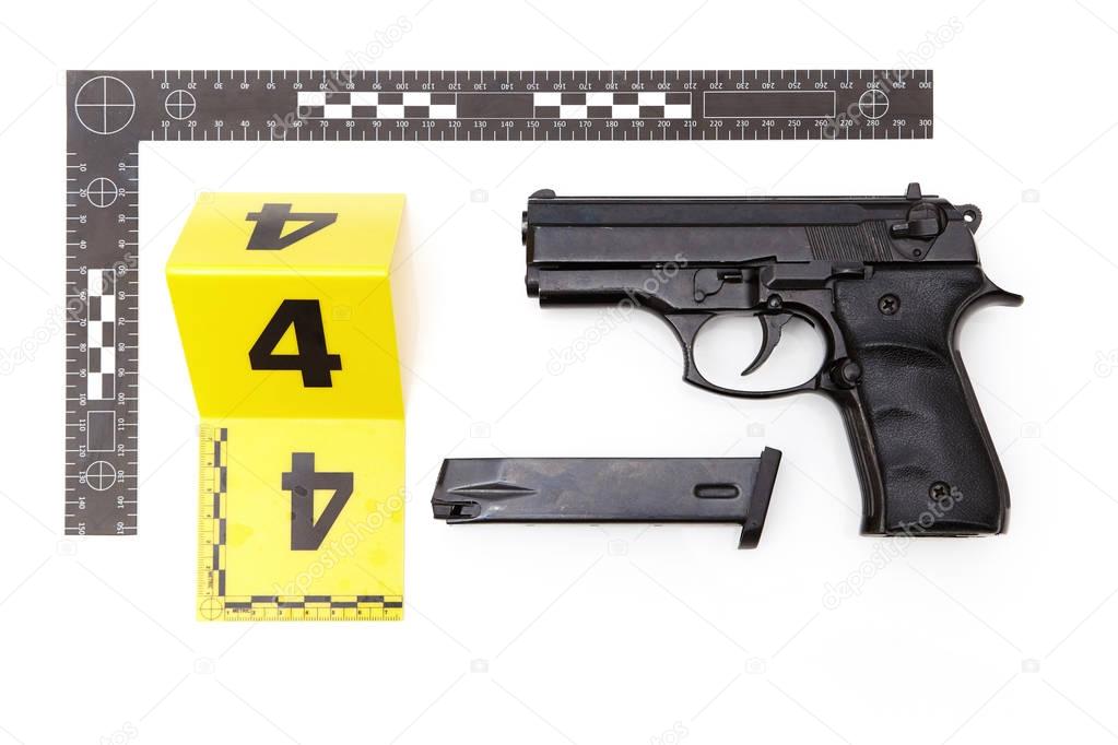 Police photo - evidence of handgun and magazine