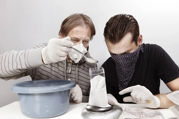 Two gang criminals weighting drugs for redistribution in room — Stock Photo, Image