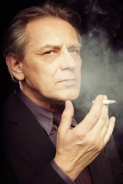 Older Caucasian Man Smoking Cigarette Black Background — Stock Photo, Image