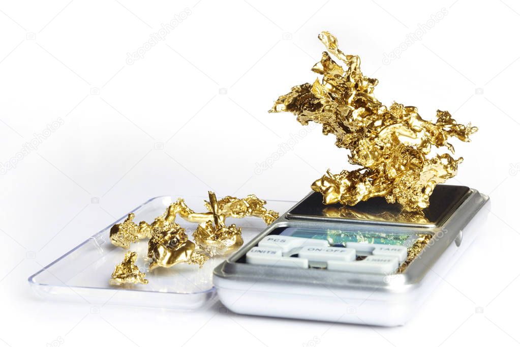 Gold pieces and nuggets found by amaterur prospector weighted on digital scale