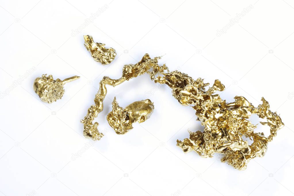 Gold pieces and nuggets found by amaterur prospector isolated on background