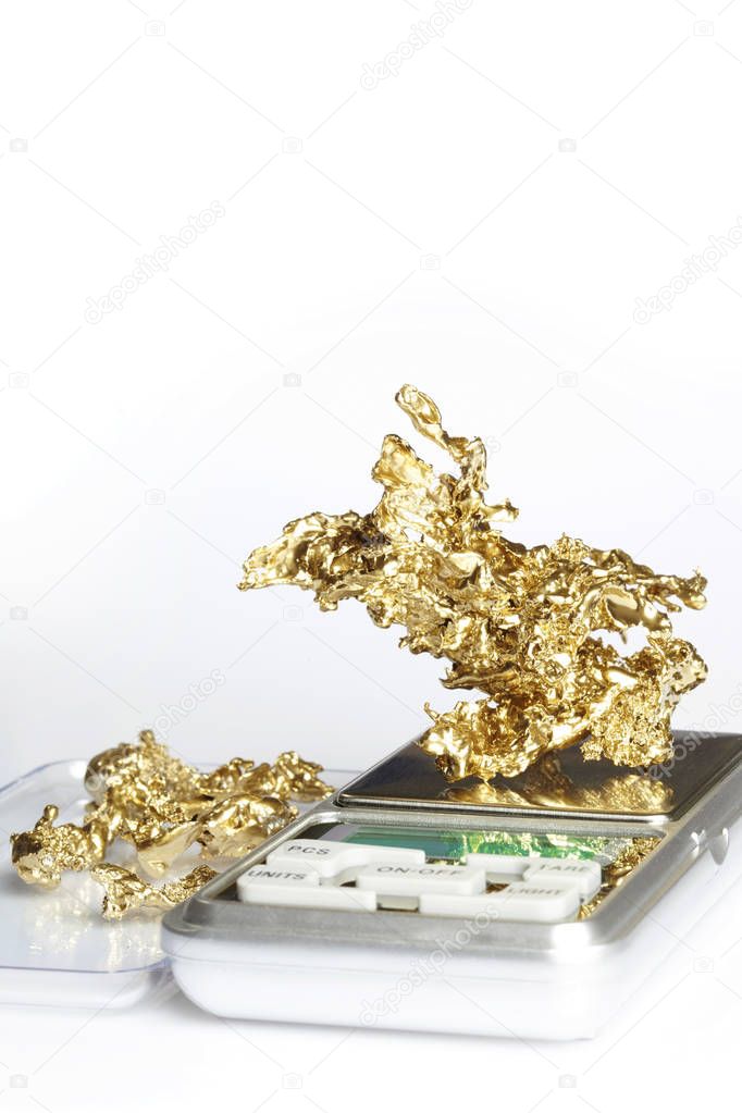 Gold pieces and nuggets found by amaterur prospector weighted on digital scale