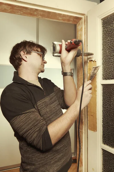 Man Home Removing Havy Layer Old Paint Door — Stock Photo, Image