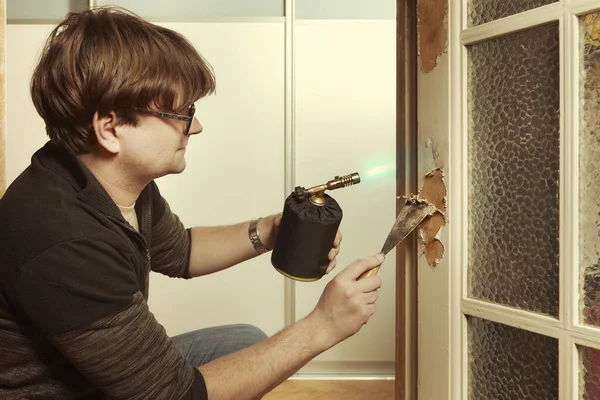 Man Home Removing Havy Layer Old Paint Door Burner — Stock Photo, Image