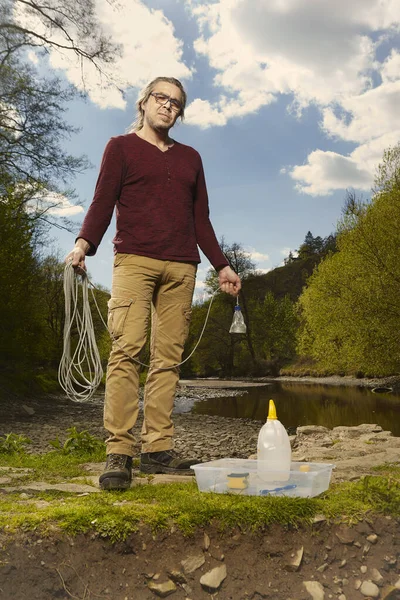 Man Trying Explore River Water Neodymium Magnet Find Something Iron — Stock Photo, Image