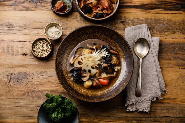 Healing Soup with roots, mushrooms and barley on wooden table background — Stock Image Healing Soup Roots Mushrooms Barley Wooden Table Background Stock Image