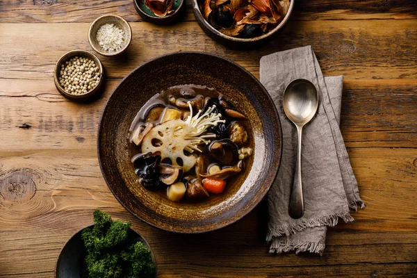 Healing Soup with roots, mushrooms and barley on wooden table background — Stock Image Healing Soup Roots Mushrooms Barley Wooden Table Background Royalty Free Stock Images