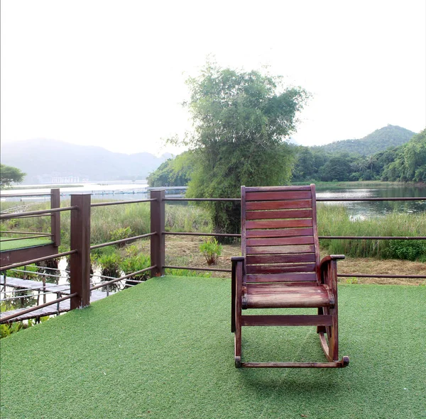 wooden rocking chair in the garden