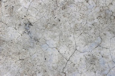 Yaş olarak çatlamış beton alçı duvar arkaplanı ve doku biçimi