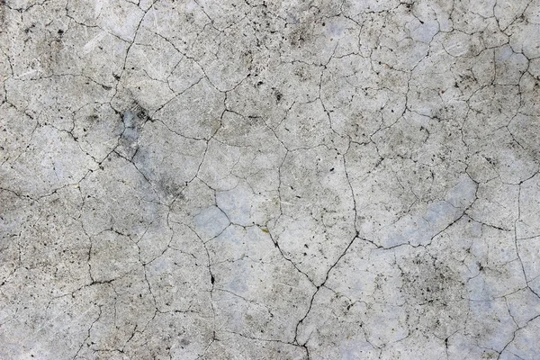 Yaş olarak çatlamış beton alçı duvar arkaplanı ve doku biçimi