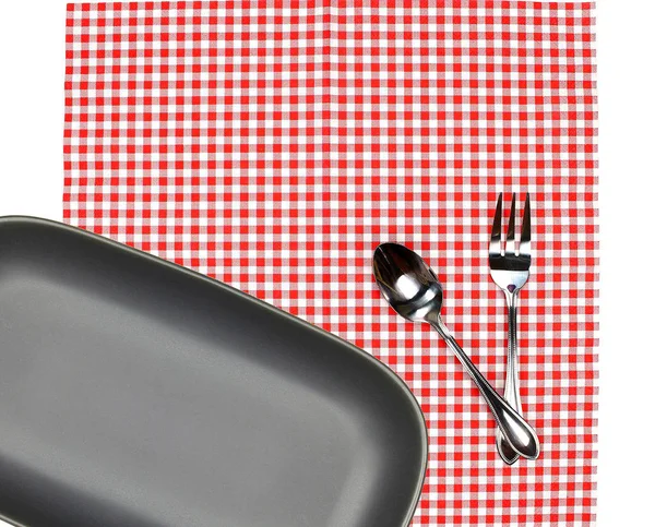 Top view plate with fork and spoon on tablecloth for food servin — Stock Photo, Image