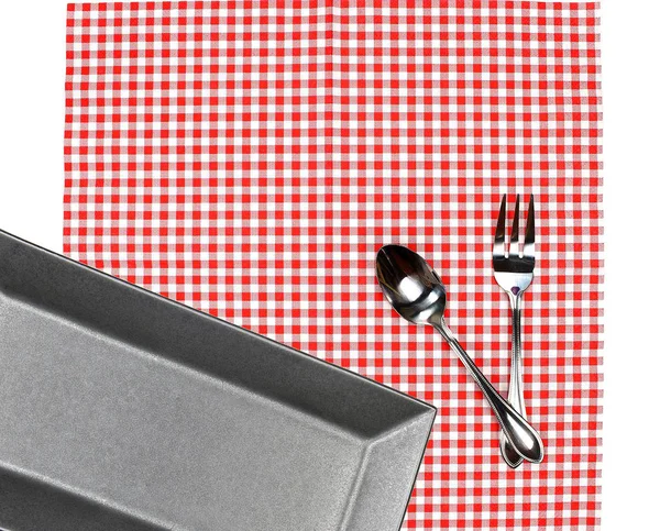 Top view plate with fork and spoon on tablecloth for food servin — Stock Photo, Image