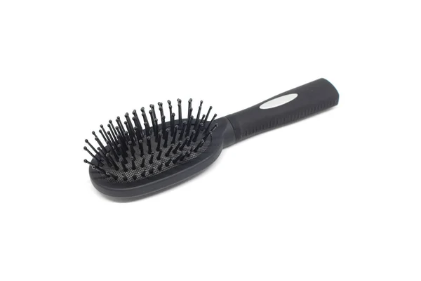 Black hairbrush on white background — Stock Photo, Image