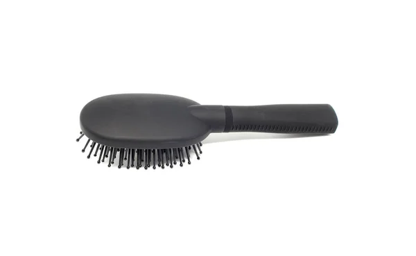 Brosse à cheveux noire sur fond blanc — Photo