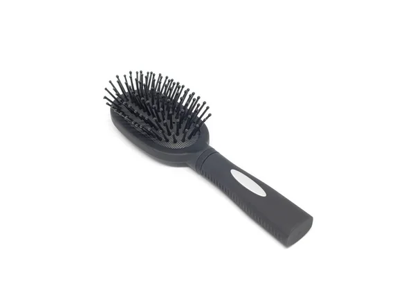 Black hairbrush on white background — Stock Photo, Image