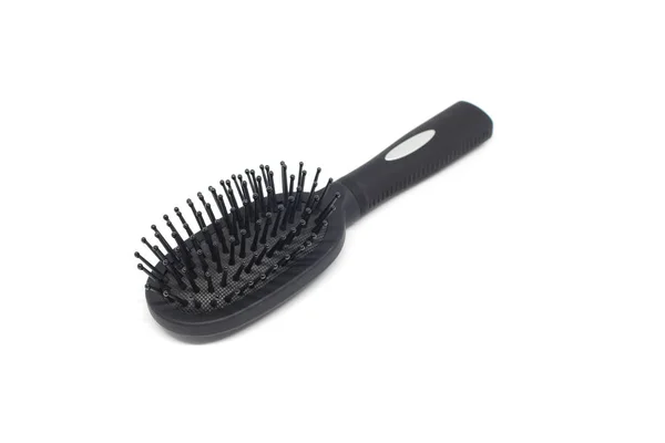 Brosse à cheveux noire sur fond blanc — Photo