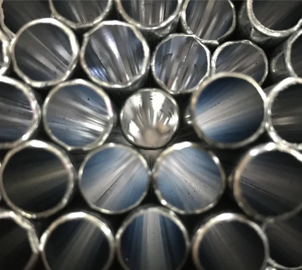 Stack of silver steel pipes — Stok fotoğraf