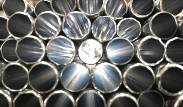 Stack of silver steel pipes — Stock Photo, Image
