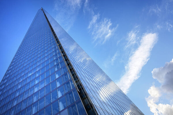 The Shard London UK low angle view up to cloudscape