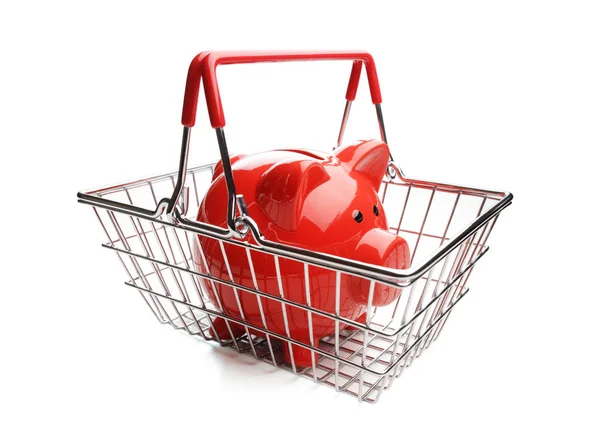 Piggy bank in shopping basket — Stock Photo, Image