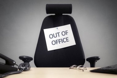 Business chair with out of office sign clipart
