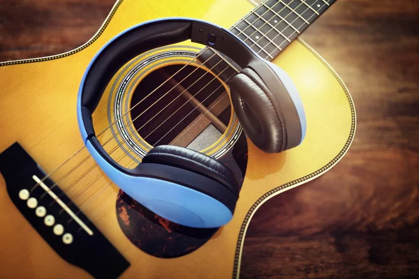 Guitar and headphones — Stock Photo, Image
