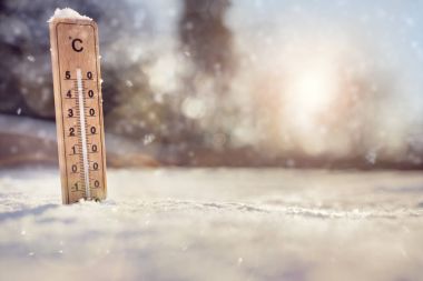 Thermometer in the snow with sub zero minus temperature concept for winter