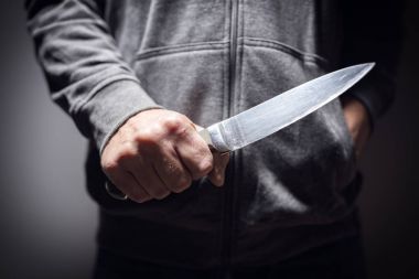 Criminal with knife weapon threatening to stab clipart