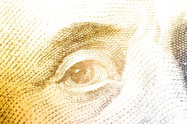 Makro banknot olarak 100 dolar. Harika bir yaklaşım. Göz, Franklin 'in yüzü 100 dolarlık banknotun üzerinde. İşaret fişeği