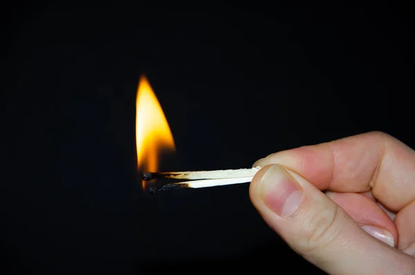 Hand Holds Burning Match Black Background Wooden Match Burns Hands — Stock Photo, Image