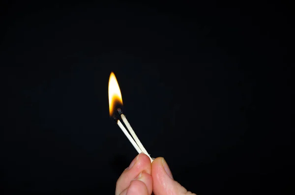 Hand Holds Burning Match Black Background Wooden Match Burns Hands — Stock Photo, Image