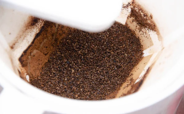 Ground coffee in a drip coffee maker close-up
