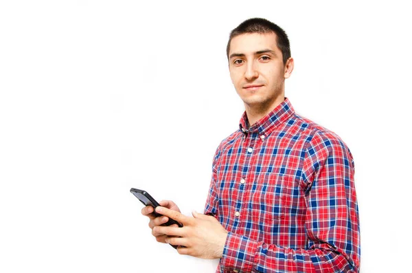 Young Man Plaid Shirt Smartphone White Background Guy Looks Camera — Stock Photo, Image