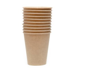 Brown paper cup for coffee, tea, a drink from environmental materials on a white background. Many cups in a one-on-one ass. A row of glasses up. Wide glasses, buckets