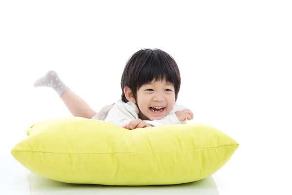 Cute Asian chid lying on big pillow — Stock Photo, Image