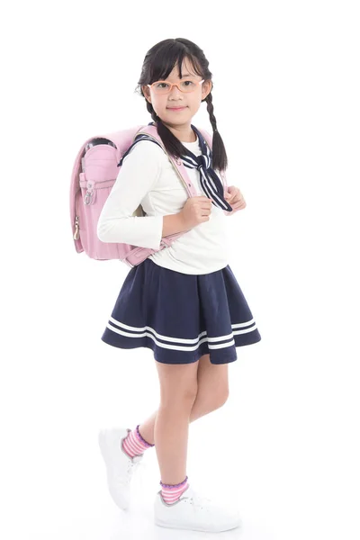 Asiatico bambino in scuola uniforme con rosa scuola borsa — Foto Stock