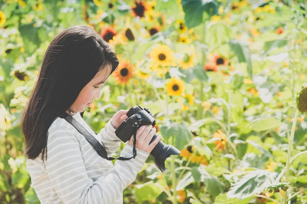 Beautiful Asian girl taking pictures — Stock Photo, Image