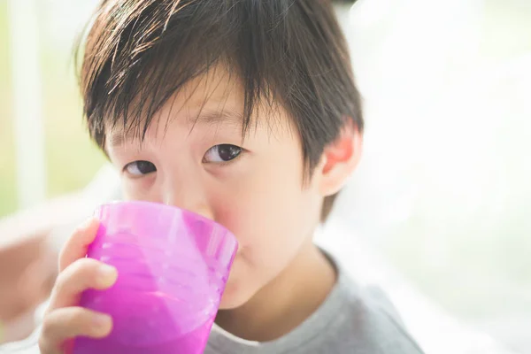 Asian child drinking water — Stock Photo, Image