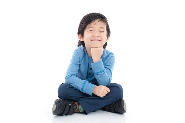 Asiático chico sentado en blanco fondo —  Fotos de Stock