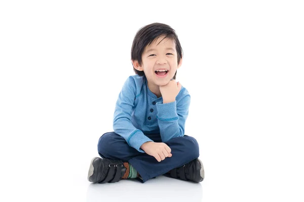 Asiático chico sentado en blanco fondo —  Fotos de Stock