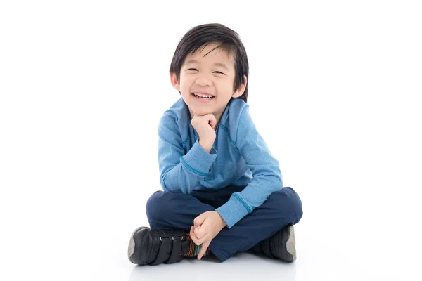 Asian boy sitting on white background Stock Image