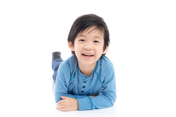 Asian boy lying on white background Stock Picture